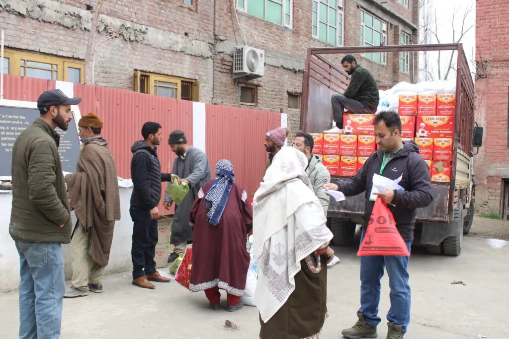 Care World volunteers providing food assistance to families